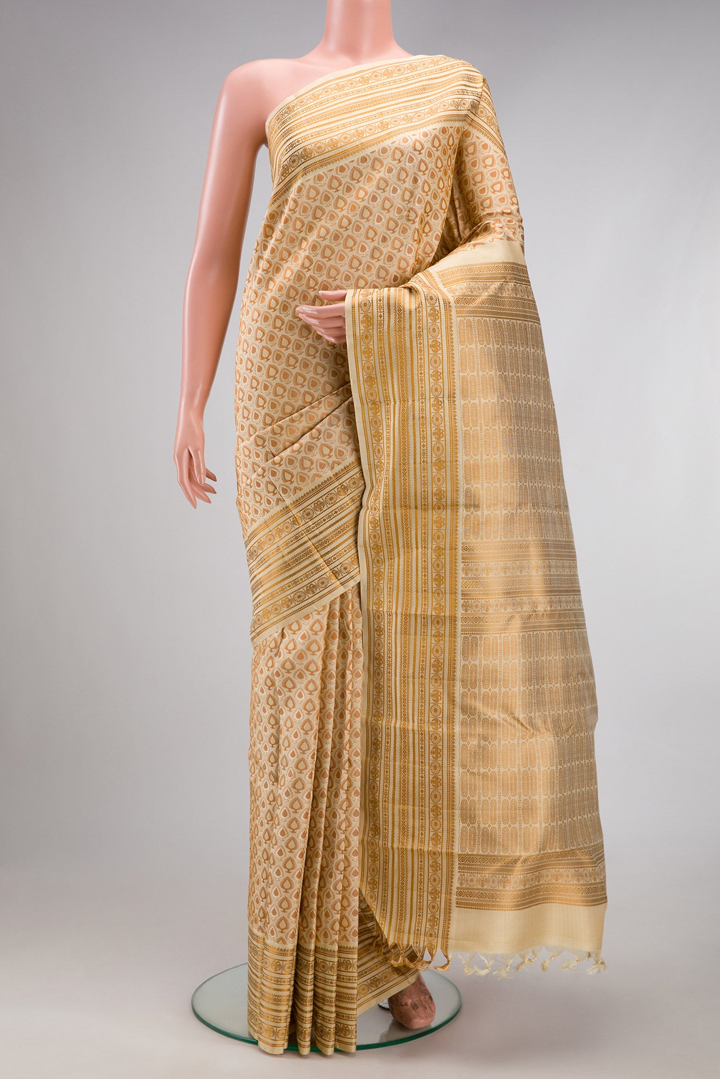 Sandal Kanjivaram Silk Saree with Jacquard design on the body and Thread Border.  displayed on a mannequin