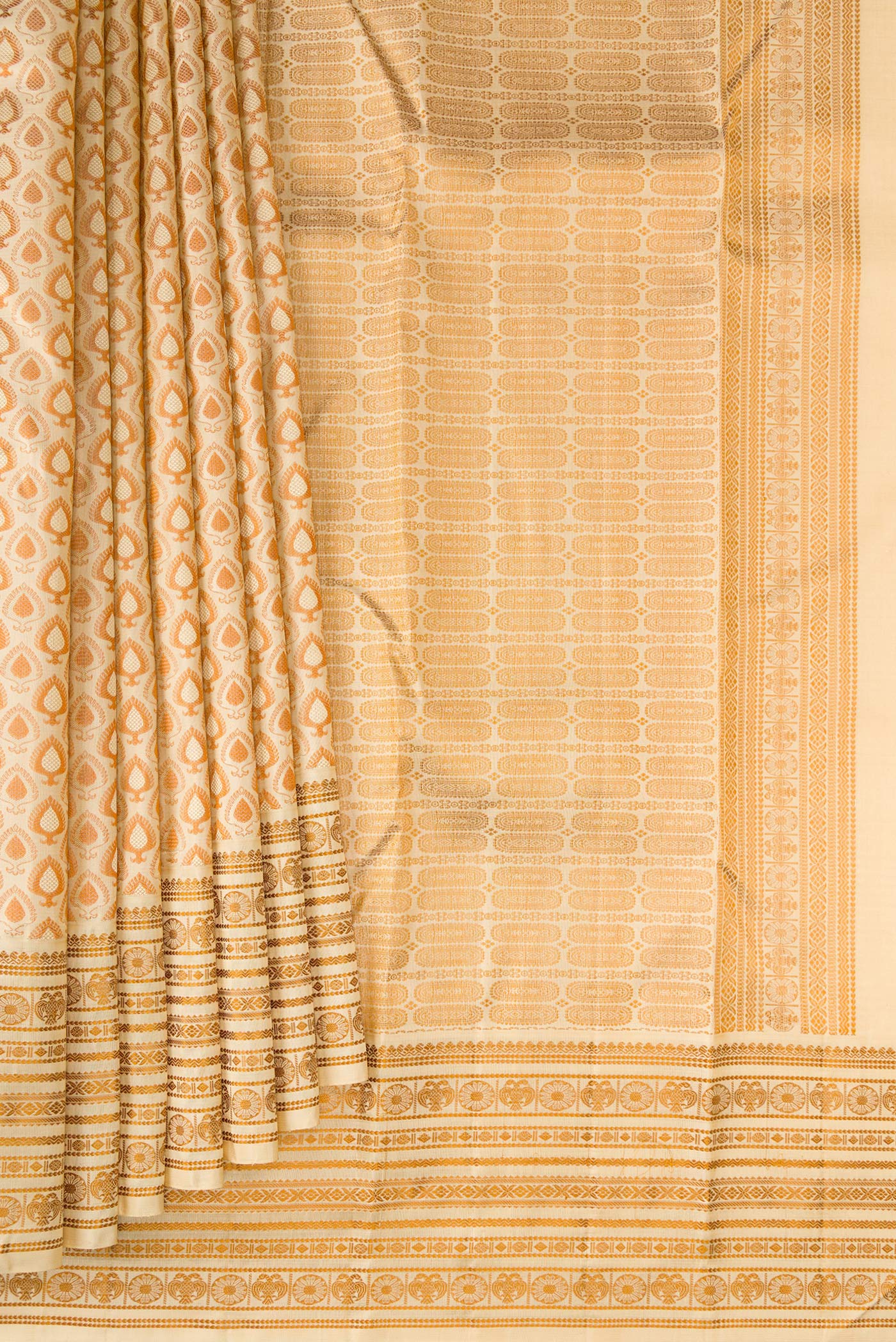 Pleats and pallu of Sandal Kanjivaram Silk Saree with Jacquard design on the body and Thread Border. 