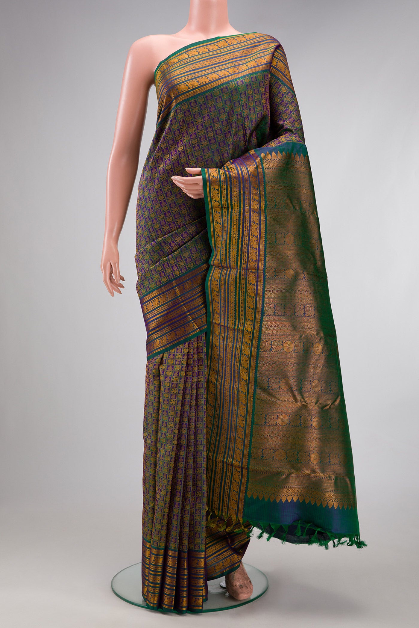 Peacock Blue Dual Tone Kanjivaram Silk Saree with Jacquard design on the body and Thread Border.  displayed on a mannequin