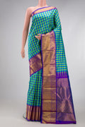 Multi Color Kanjivaram Silk Saree with Checked design on the body and Zari Border.  displayed on a mannequin