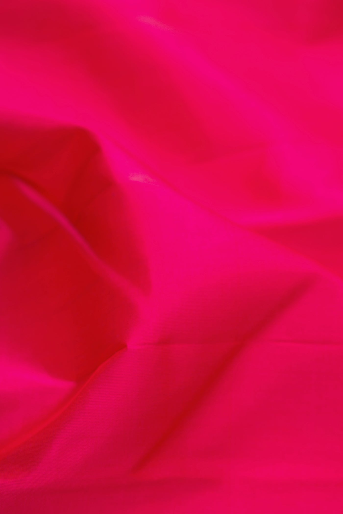 Close up of Pure Silk Pure Zari Pink Kanchipuram Saree with Plain Body and Temple Border.  displaying folds