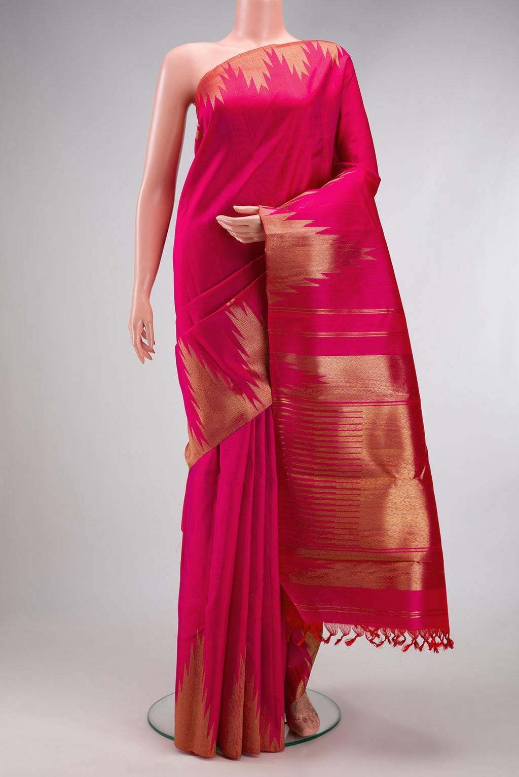Pure Silk Pure Zari Pink Kanchipuram Saree with Plain Body and Temple Border.  displayed on a mannequin