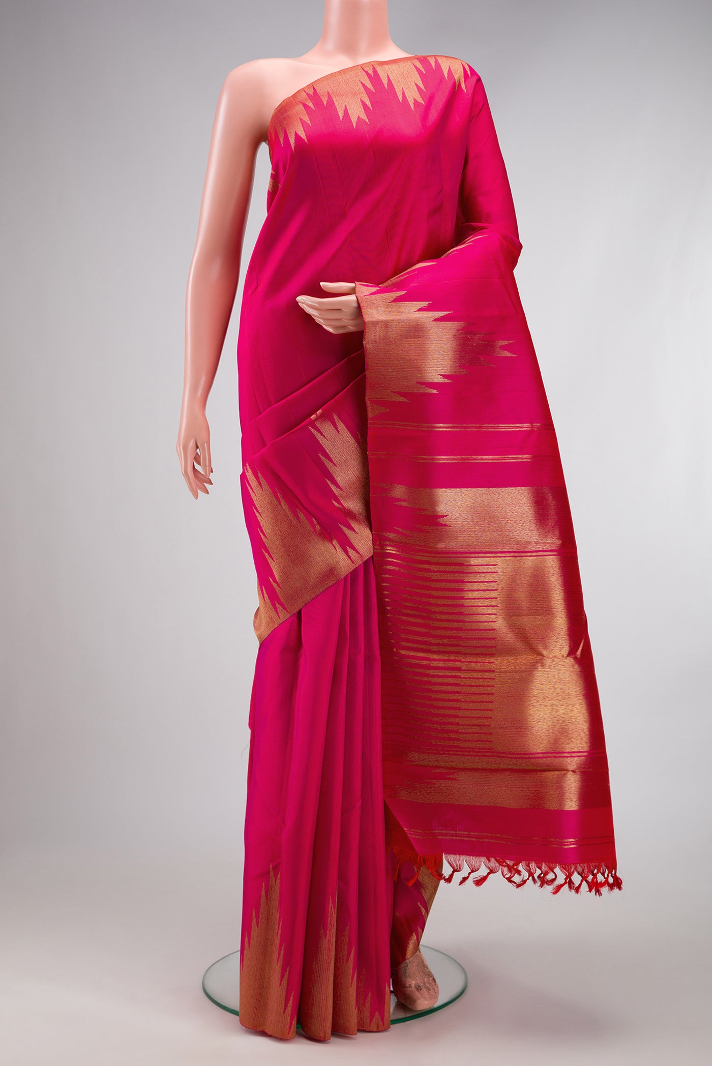Pure Silk Pure Zari Pink Kanchipuram Saree with Plain Body and Temple Border.  displayed on a mannequin