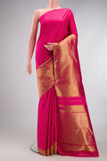 Pure Silk Pure Zari Pink Kanjivaram Saree with Plain Body and Rising Temple Border.  displayed on a mannequin