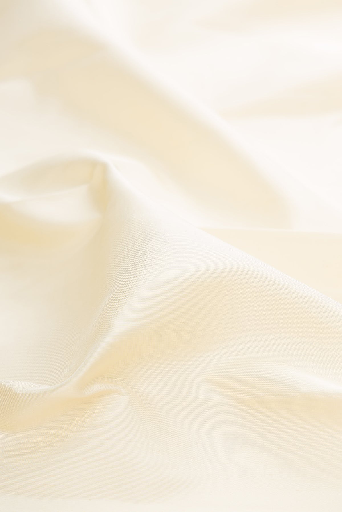 Close up of Pure Silk Pure Zari Off White Kanjivaram Saree with Plain Body and Temple Border.  displaying folds