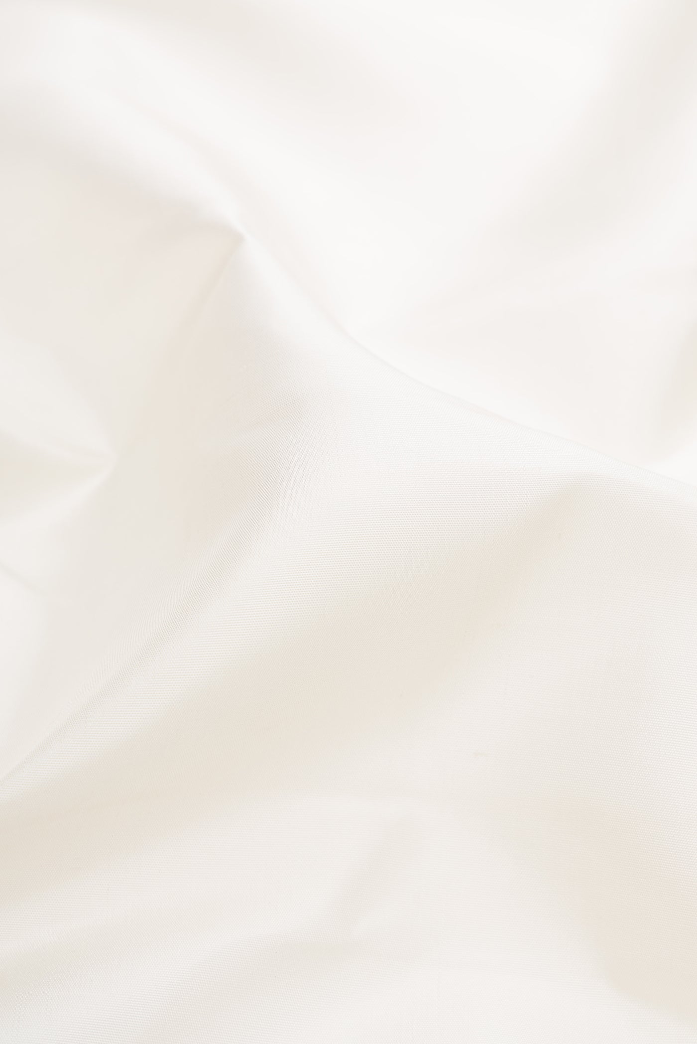 Close up of Pure Silk Pure Zari White Kanjivaram Saree with Plain Body and Temple Border.  displaying folds