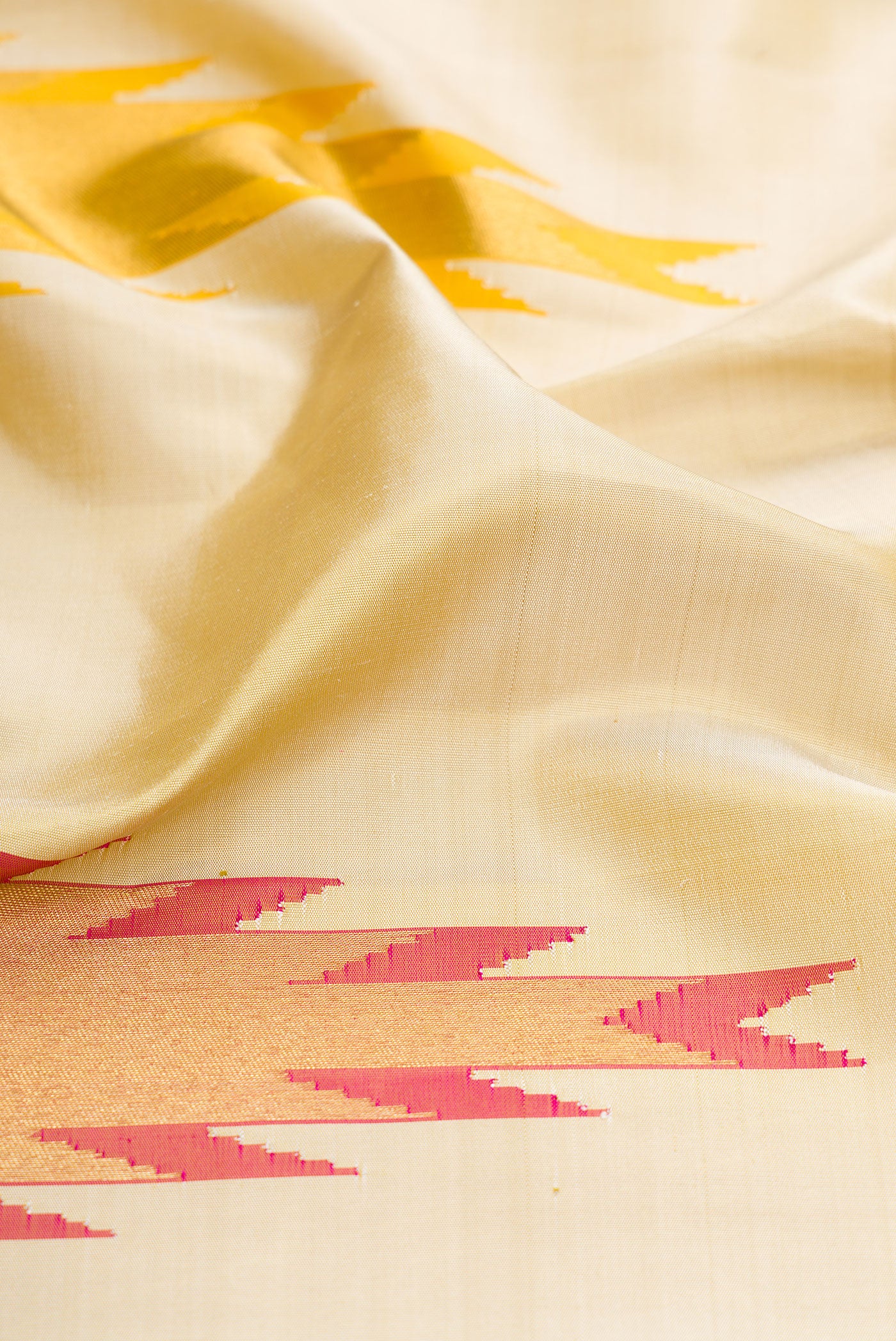 Close up of Pure Silk Pure Zari Sandal Dual Tone Kanjivaram Saree with Plain Body and Temple Border.  displaying folds