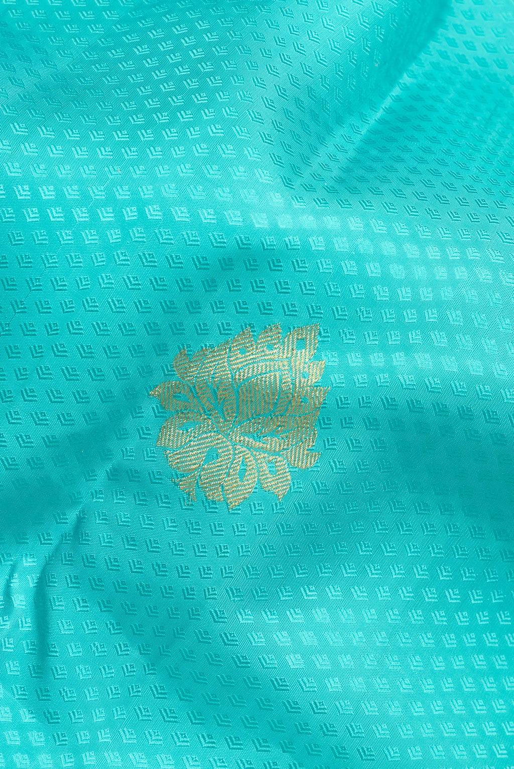 Close up of Pure Silk Sky Blue Kanchipuram Saree with Jacquard With Zari Butta on the body and Zari Border.  displaying folds