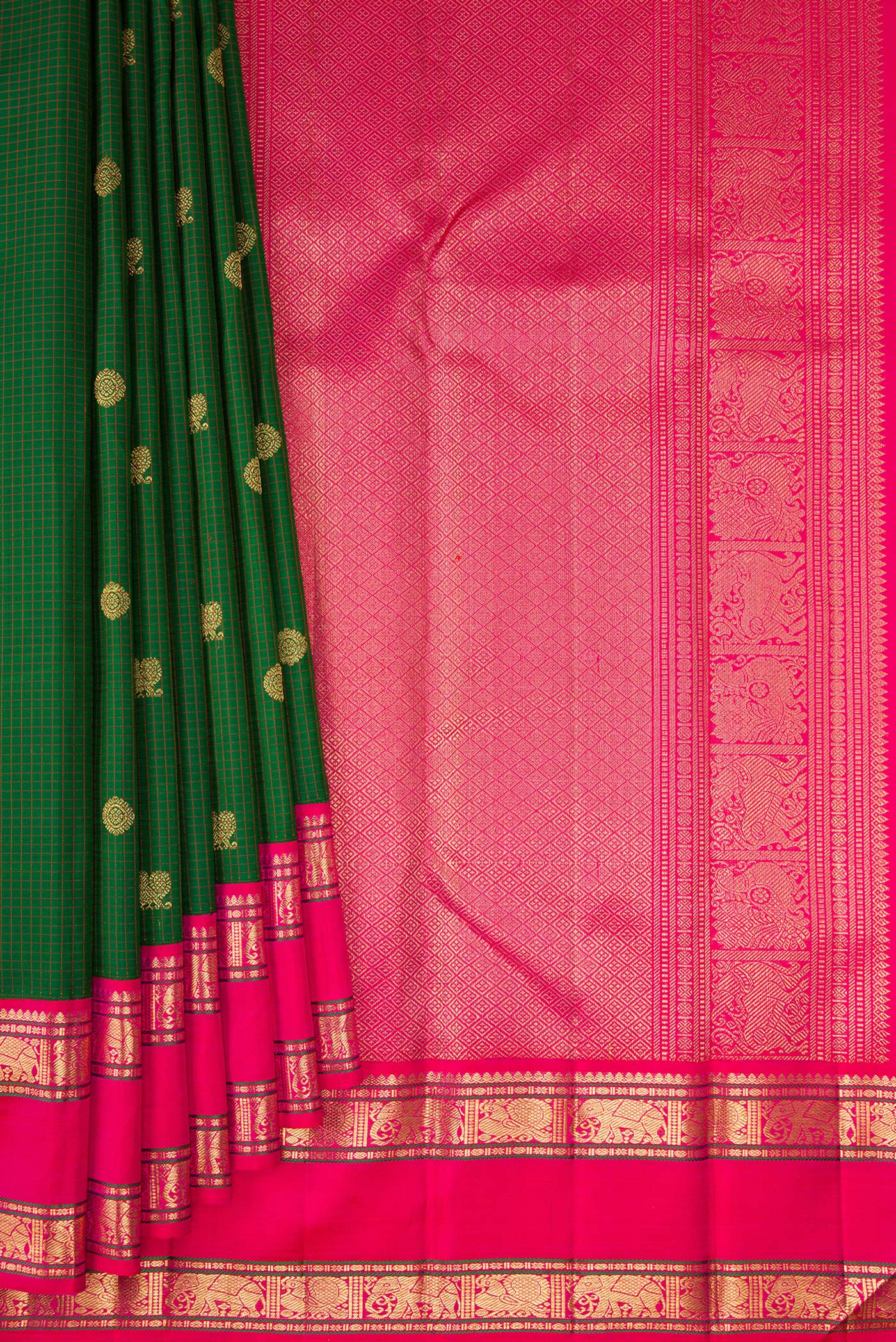 Pleats and pallu of Pure Silk Pure Zari Green Kanjivaram Saree with Zari Butta on the body and Zari Border. 