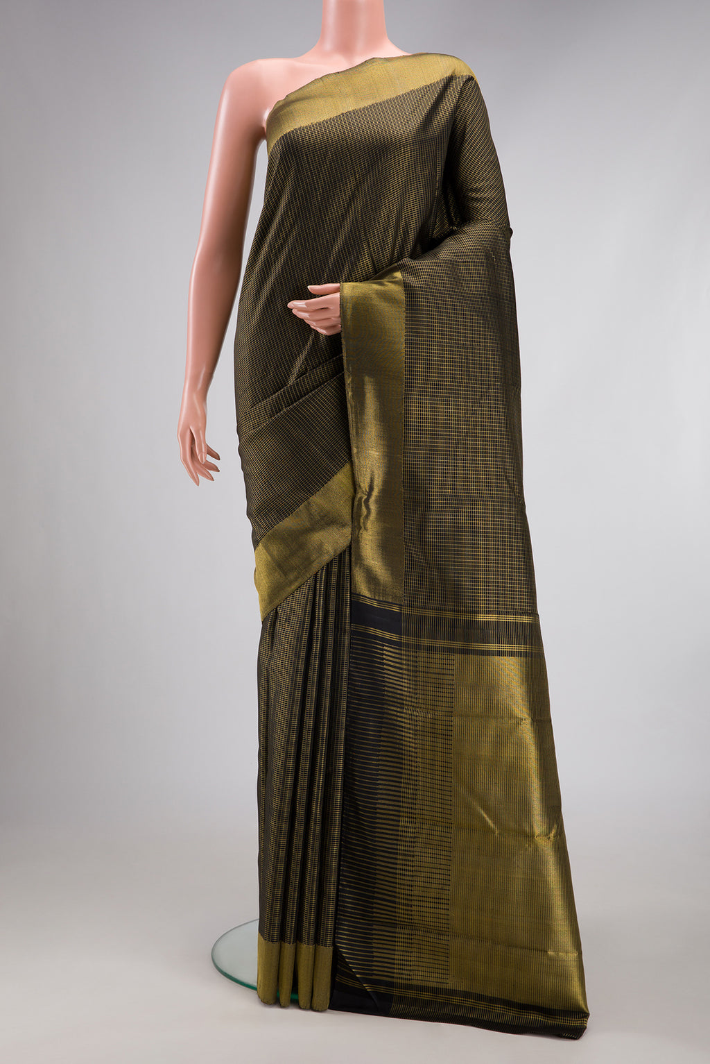 Black Kanchipuram Silk Saree with Checked design on the body and Zari Border.  displayed on a mannequin