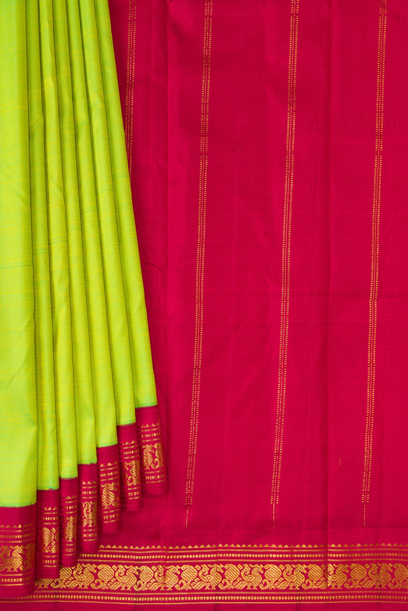 Pleats and pallu of Pure Silk Pure Zari Parrot Green Kanjivaram Saree with Plain Body and One Side Border. 