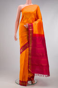 Pure Silk Pure Zari Orange Kanjivaram Saree with Plain Body and One Side Border.  displayed on a mannequin