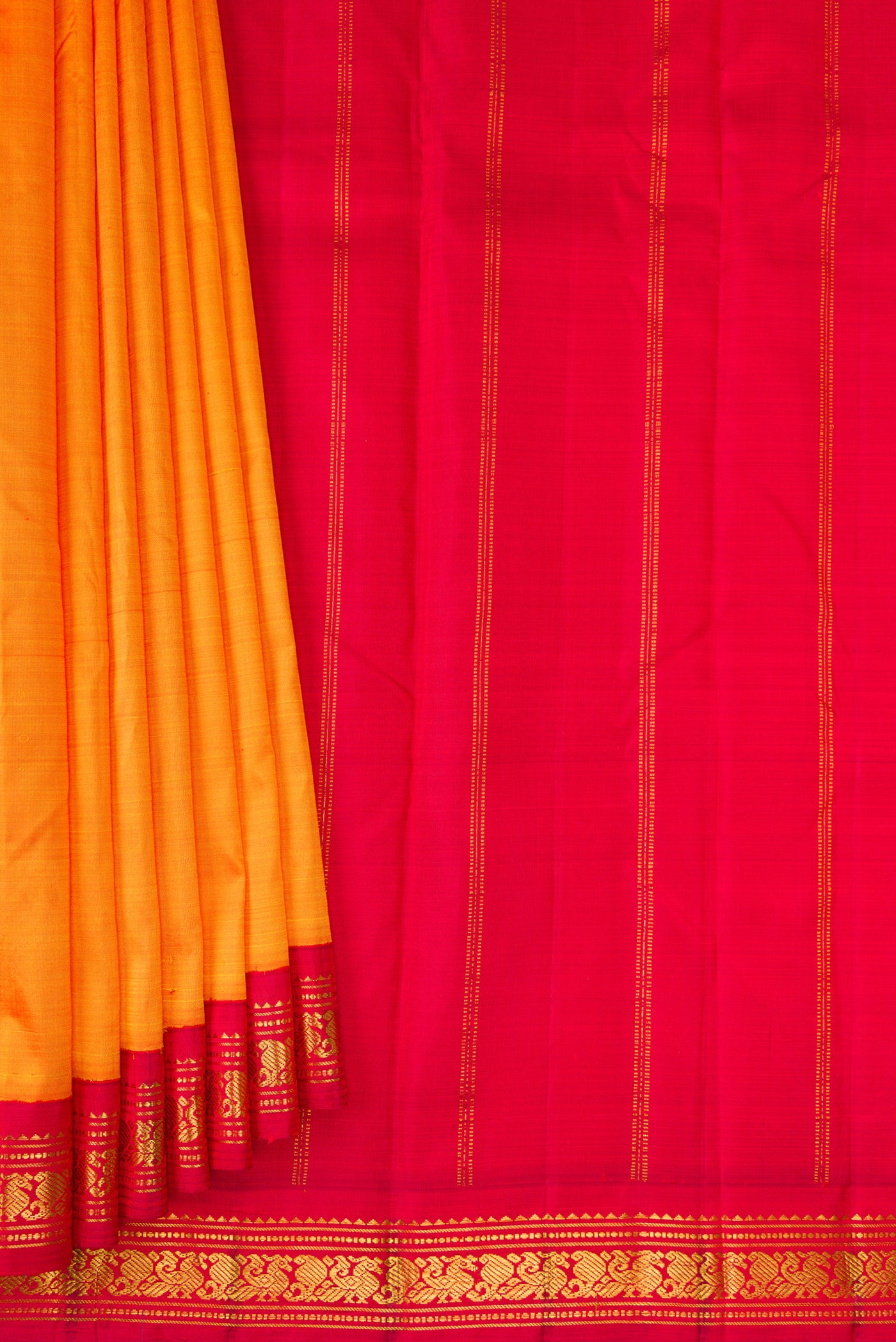 Pleats and pallu of Pure Silk Pure Zari Orange Kanjivaram Saree with Plain Body and One Side Border. 
