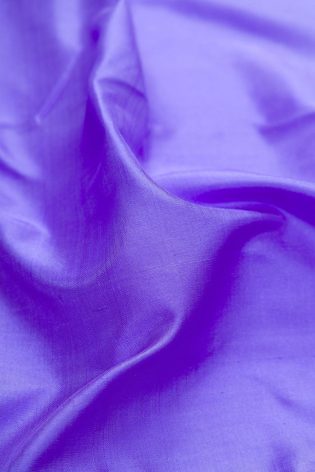 Close up of Pure Silk Pure Zari Maya Blue Kanjivaram Saree with Plain Body and One Side Border.  displaying folds