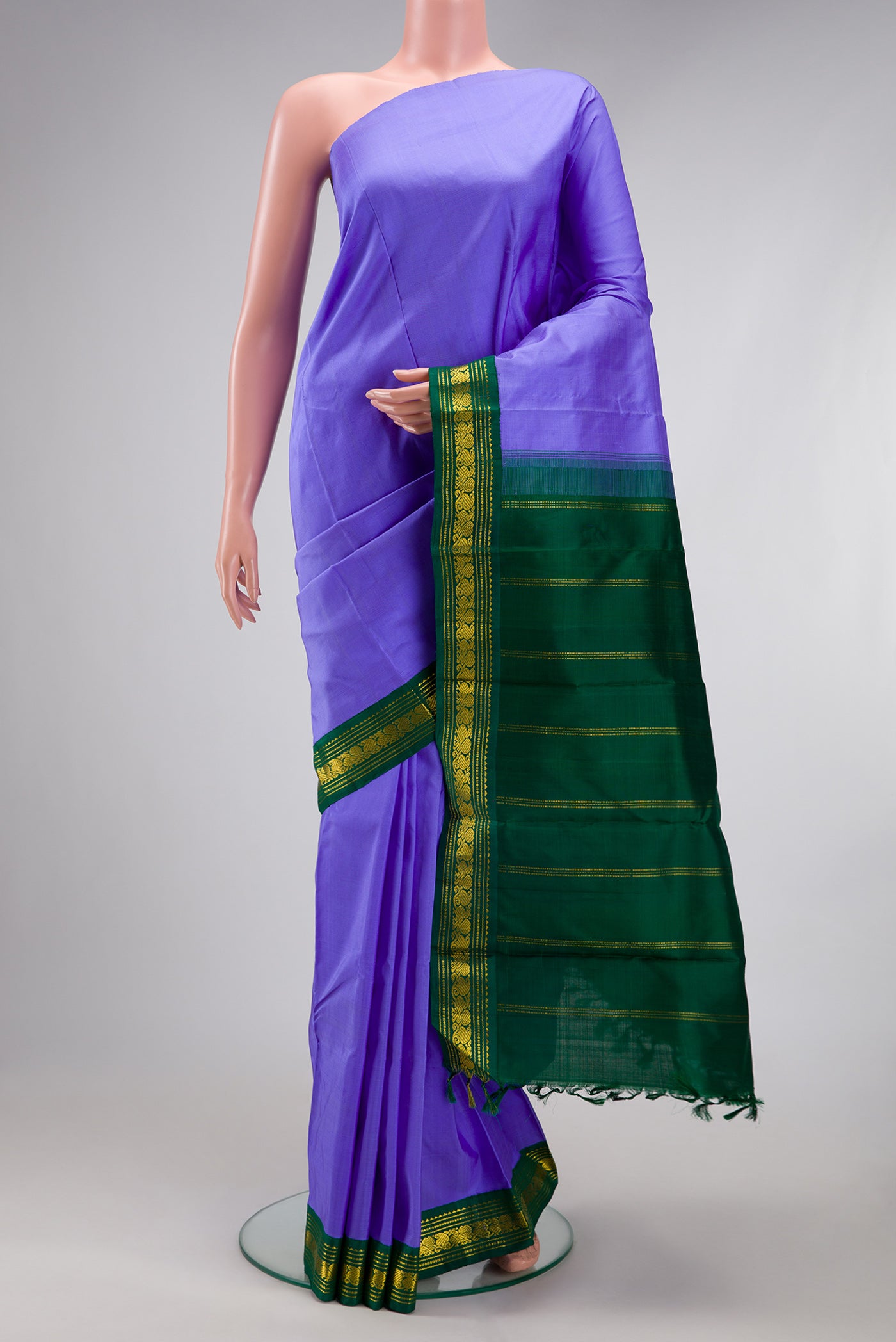 Pure Silk Pure Zari Maya Blue Kanjivaram Saree with Plain Body and One Side Border.  displayed on a mannequin
