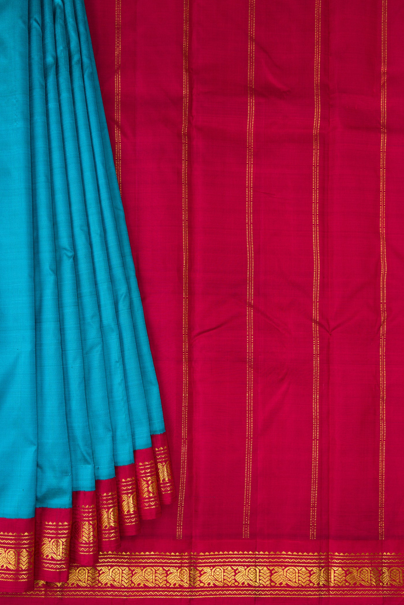 Pleats and pallu of Pure Silk Pure Zari Peacock Blue Kanjivaram Saree with Plain Body and One Side Border. 
