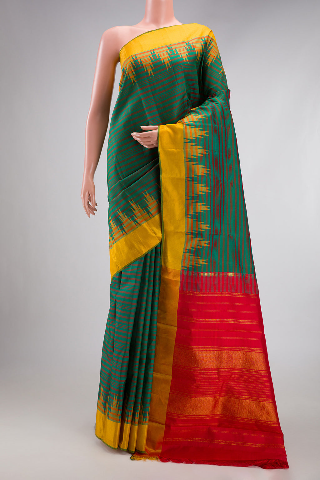 Bottle Green Dual Tone Kanjivaram Silk Saree with Stripes on the body and Temple Border.  displayed on a mannequin