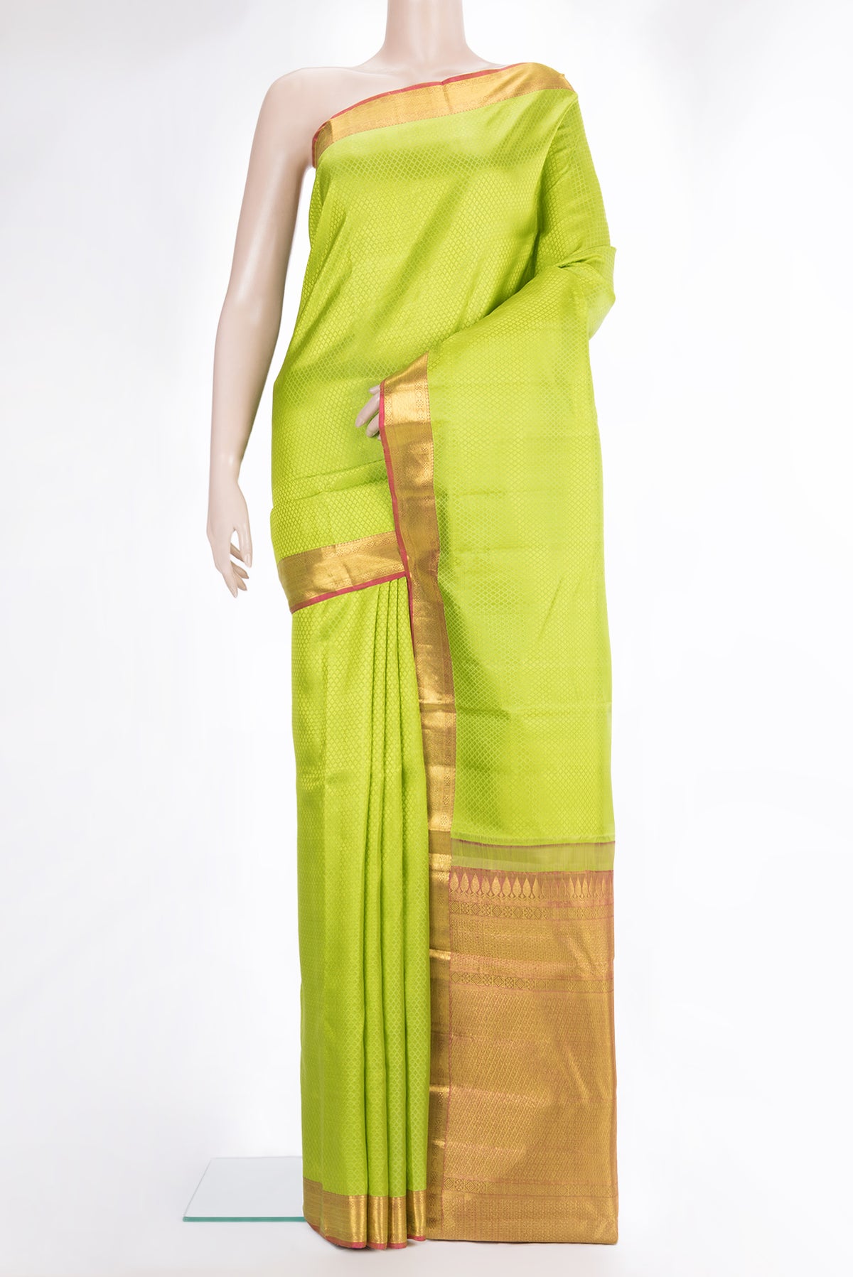 Pure Silk Parrot Green Kanchipuram Saree with Jacquard design on the body and Zari Border.  displayed on a mannequin