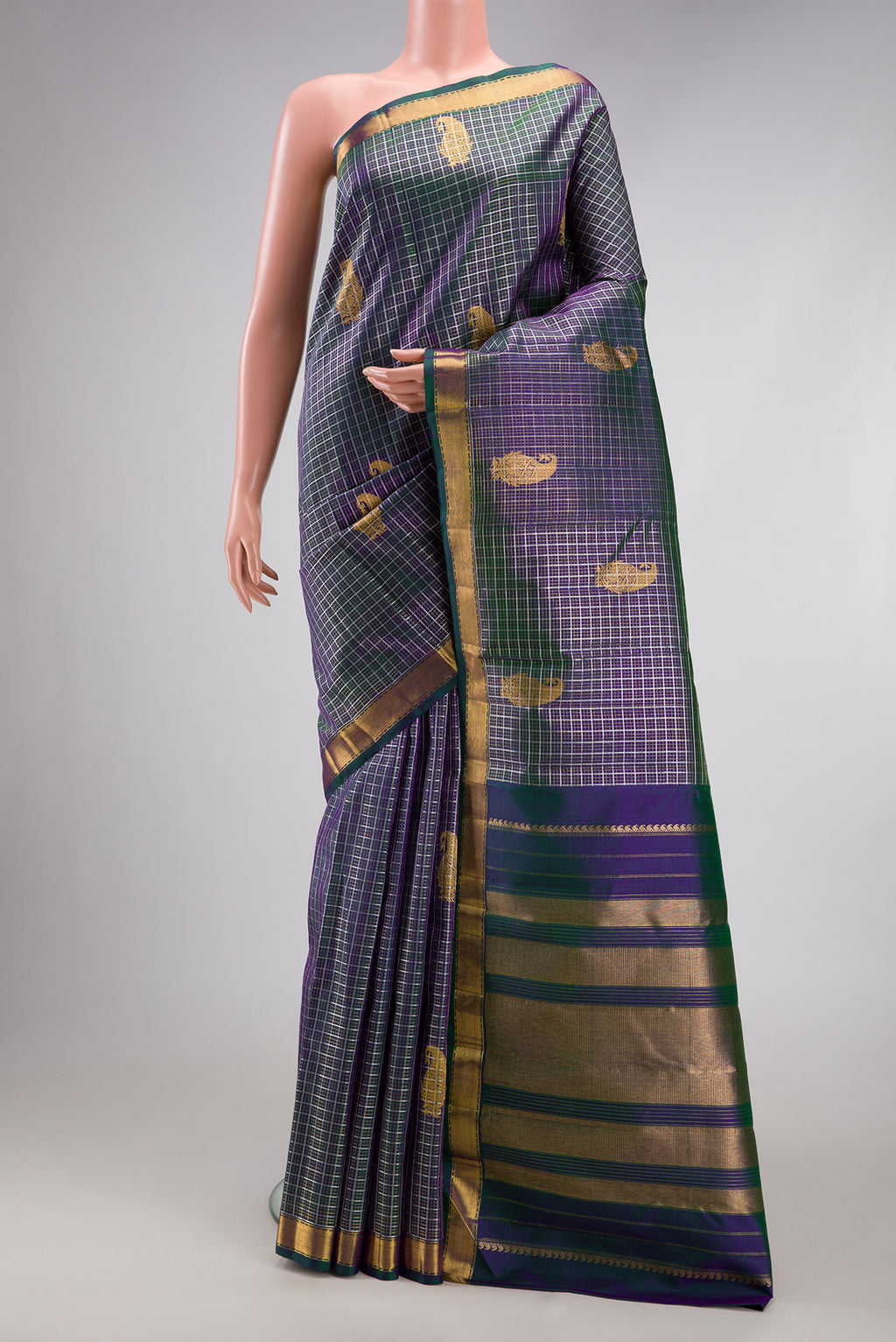 Peacock Blue Dual Tone Kanchipuram Silk Saree with Checked design on the body and Zari Border.  displayed on a mannequin