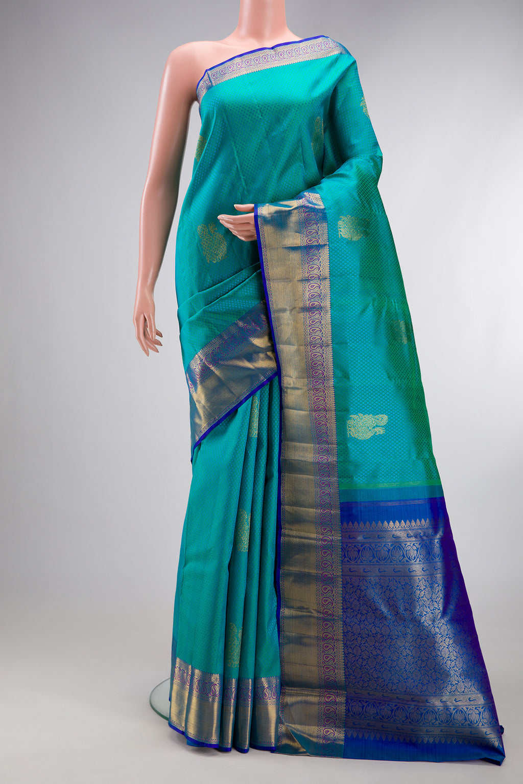 Sea Green Kanjivaram Silk Saree with Jacquard With Zari Butta on the body and Zari Border.  displayed on a mannequin