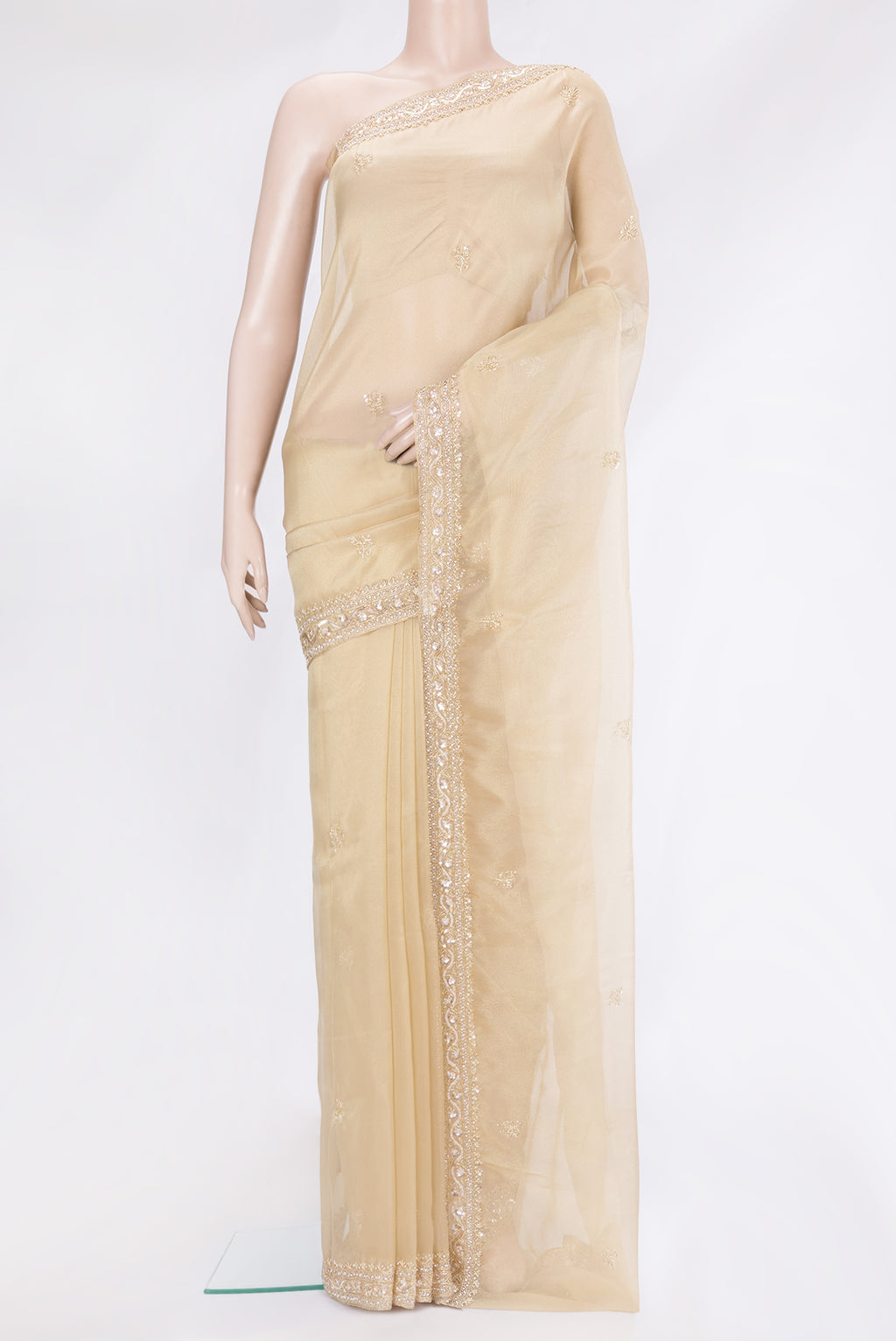 Beige Organza Silk Saree with Embroidery on the body and Sequin Border.  displayed on a mannequin