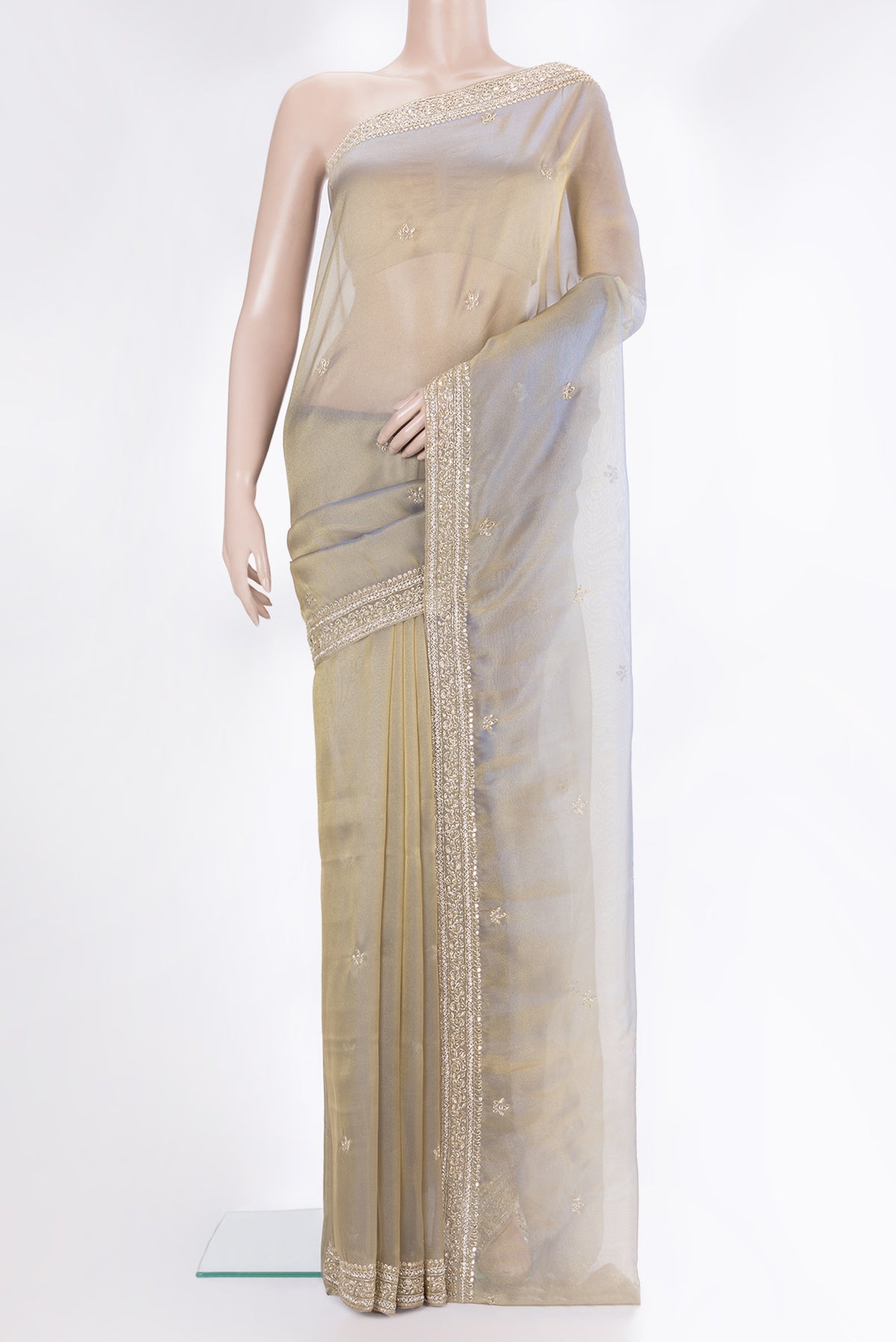 Gold with Blue Color Organza Saree with Embroidery on the body and Sequin Border.  displayed on a mannequin