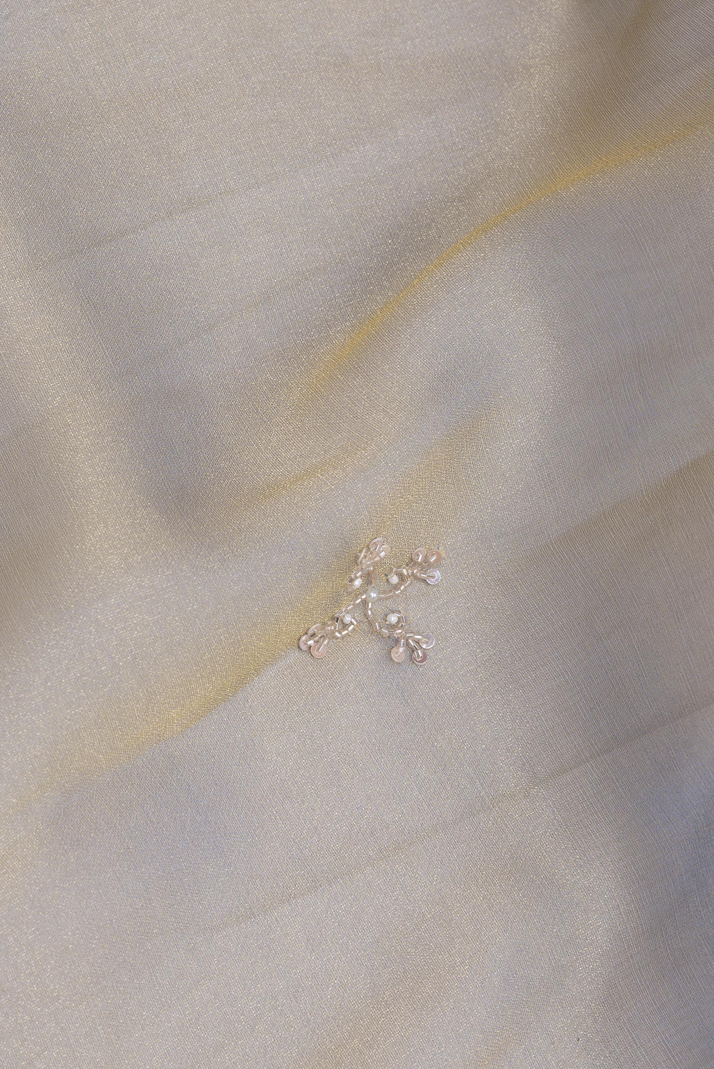 Close up of Light Blue Dual Tone Organza Silk Saree with Embroidery on the body and Sequin Border.  displaying folds