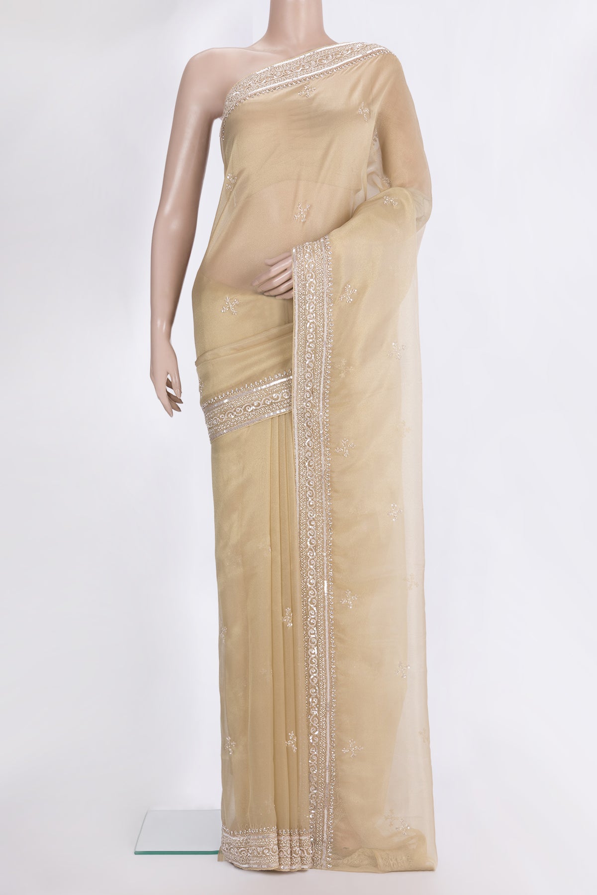 Beige Dual Tone Organza Saree with Embroidered on the body and Sequin Border.  displayed on a mannequin