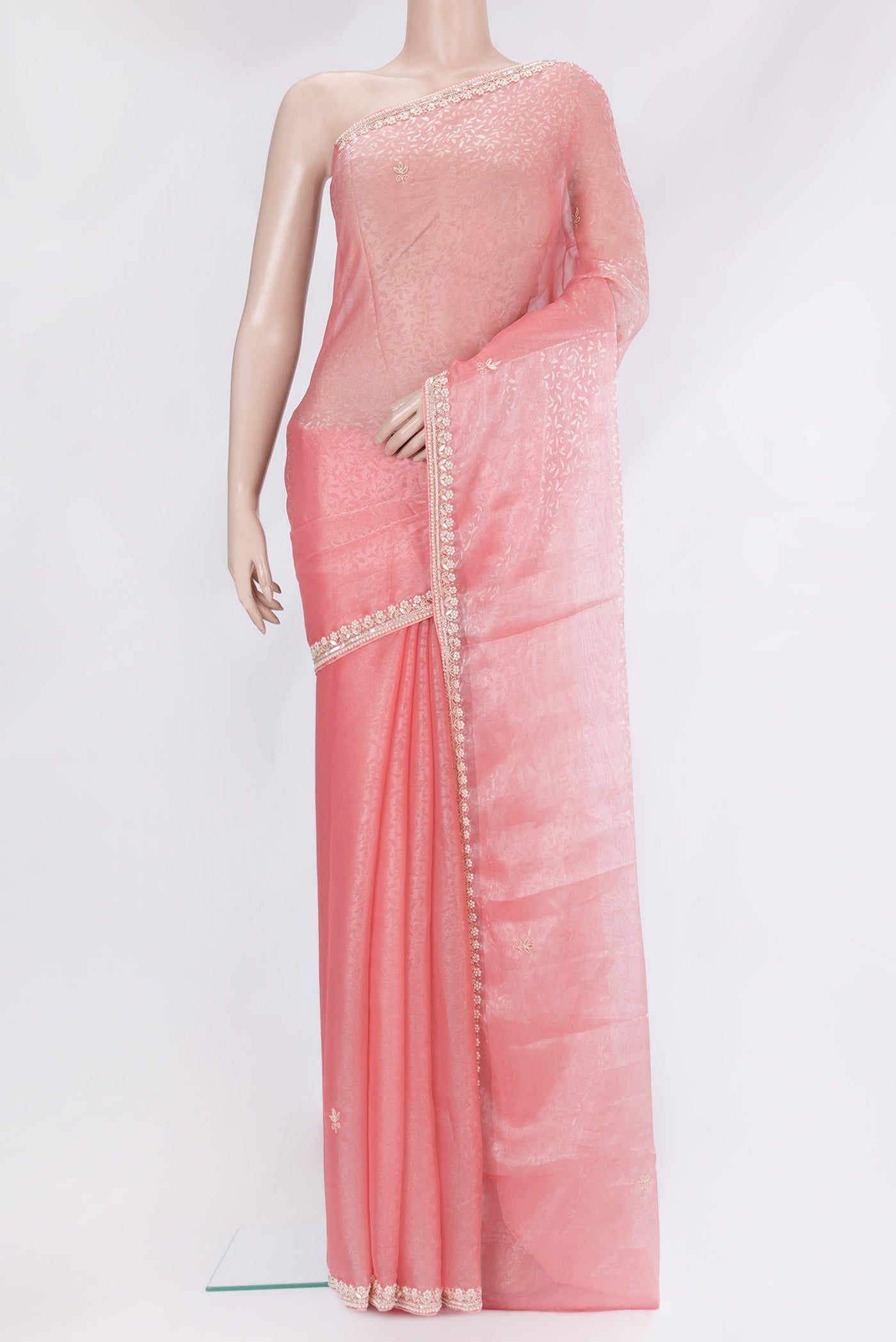 Pink Organza Silk Saree with Embroidery on the body and Embroidery Border.  displayed on a mannequin
