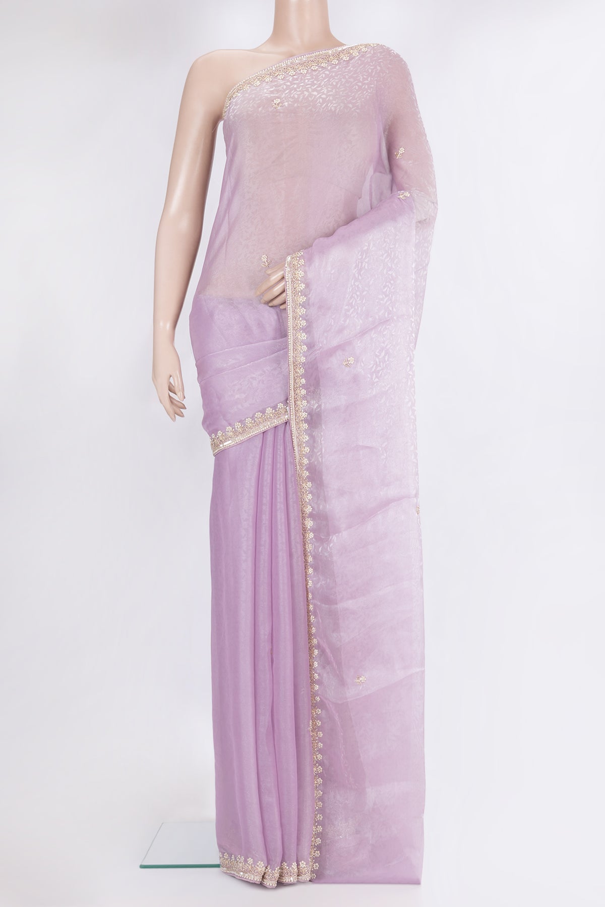 Lavender Organza Silk Saree with Embroidery on the body and Sequin Border.  displayed on a mannequin