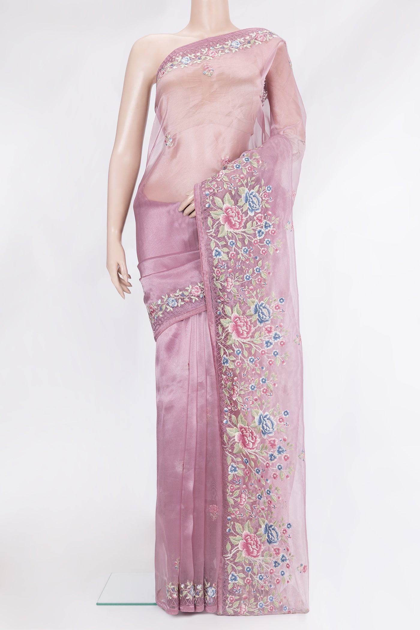 Lavender Organza Silk Saree with Embroidery on the body and Embroidery Border.  displayed on a mannequin