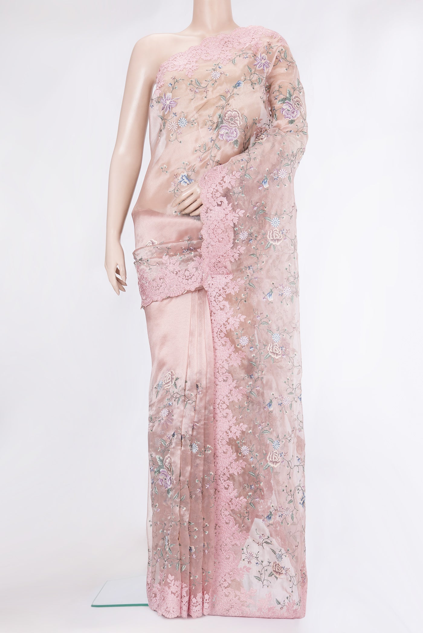Rose Gold Organza Silk Saree with Embroidery on the body and Embroidery Border.  displayed on a mannequin