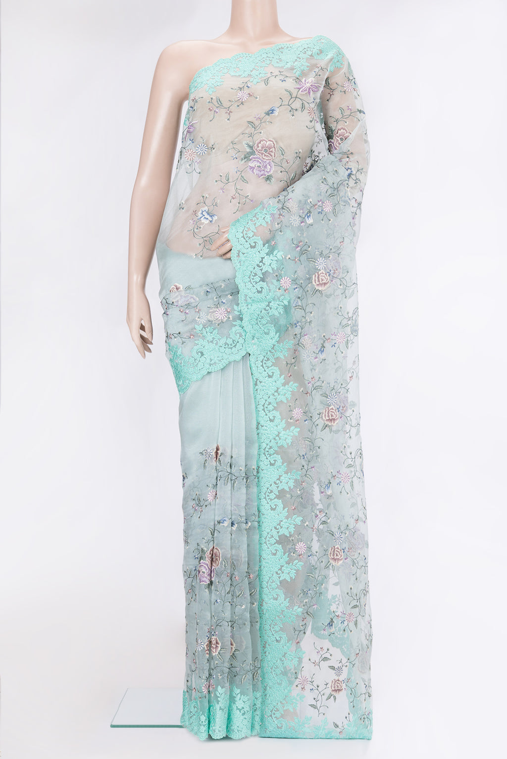 Light Blue Organza Silk Saree with Embroidery on the body and Embroidery Border.  displayed on a mannequin