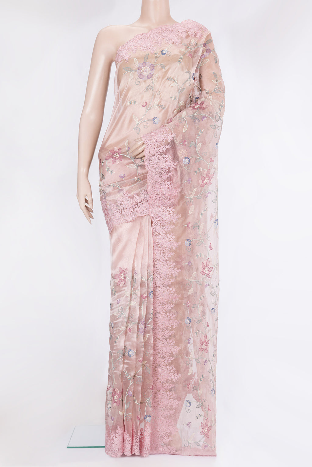 Rose Gold Organza Silk Saree with Embroidery on the body and Embroidery Border.  displayed on a mannequin