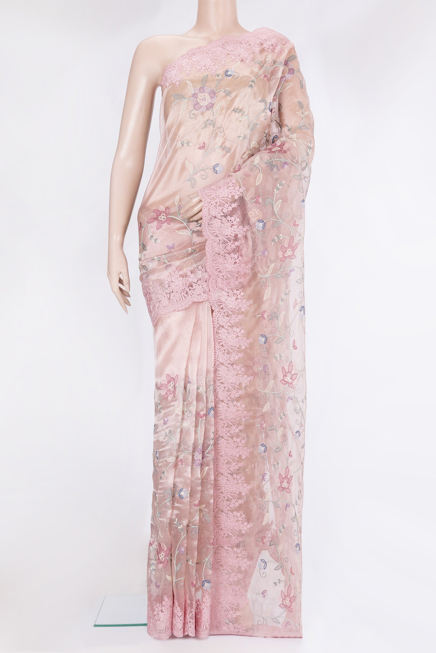 Rose Gold Organza Silk Saree with Embroidery on the body and Embroidery Border.  displayed on a mannequin