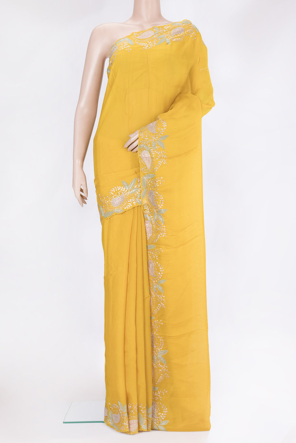 Yellow Organza Silk Saree with Plain Body and Embroidery Border.  displayed on a mannequin