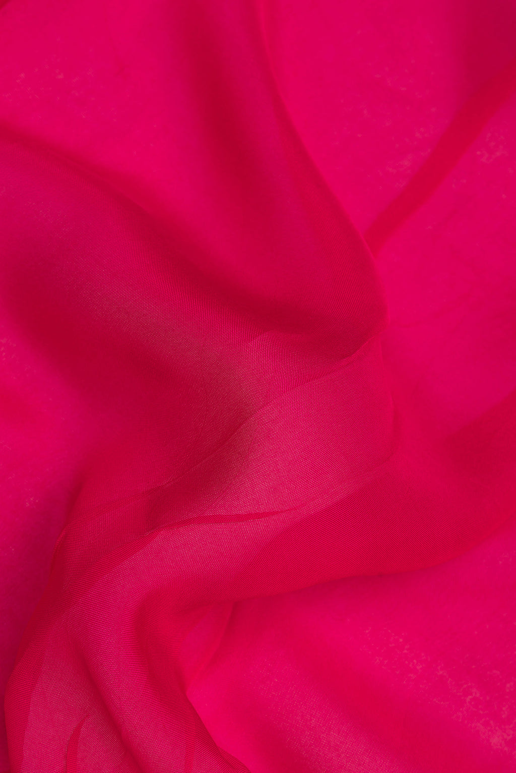 Close up of Dark Pink Organza Saree with Embroidery on the body and Embroidery Border.  displaying folds