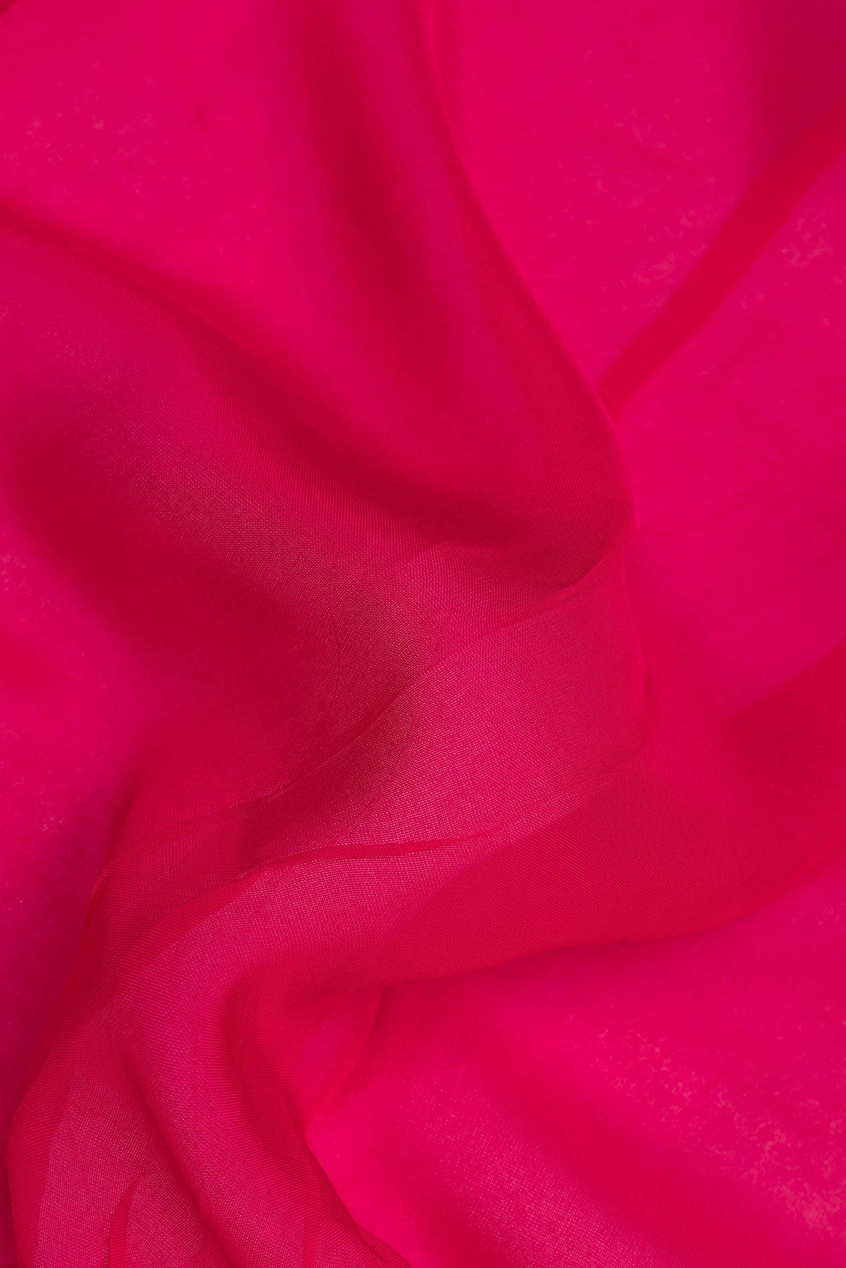 Close up of Dark Pink Organza Saree with Embroidery on the body and Embroidery Border.  displaying folds