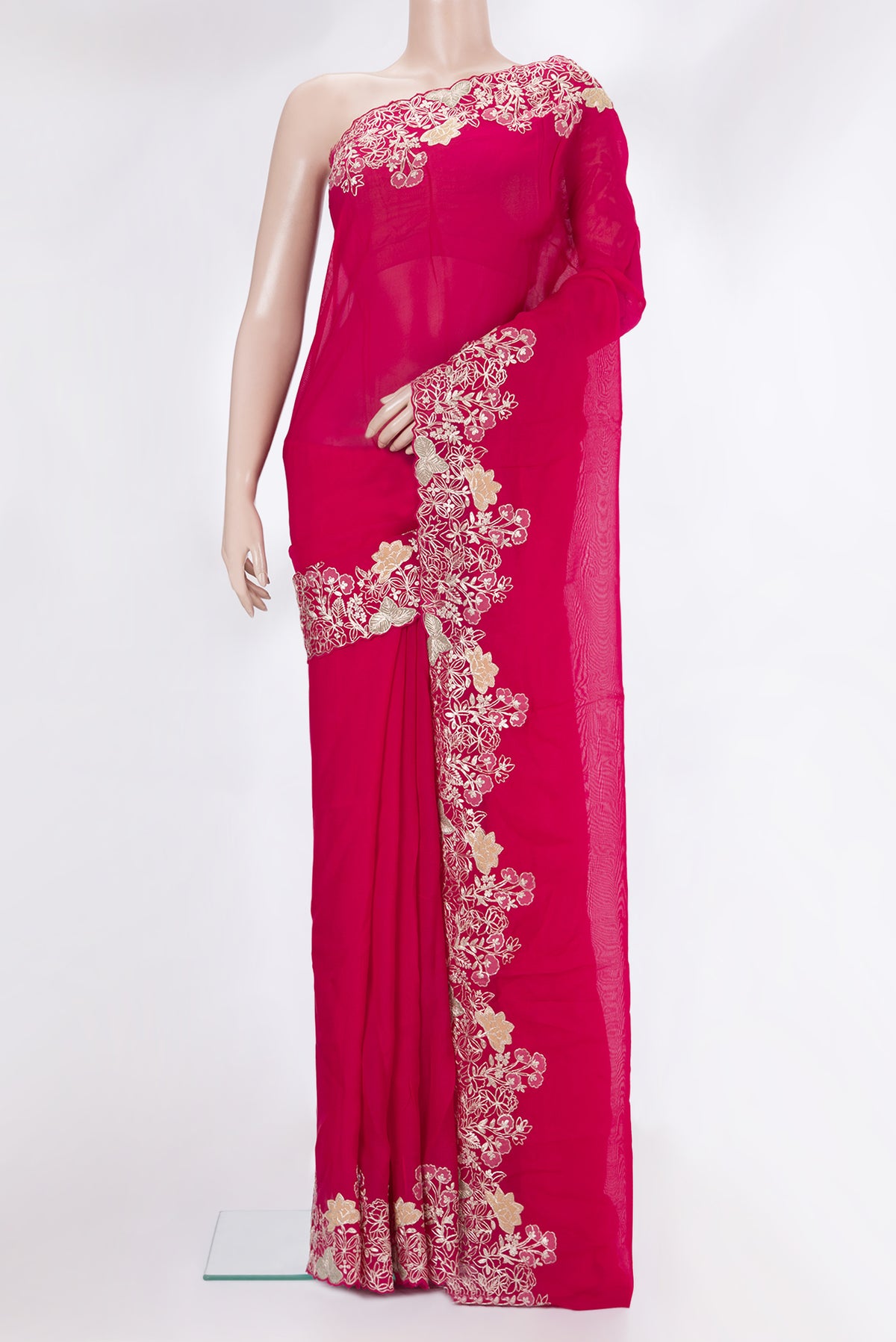 Dark Pink Organza Saree with Embroidery on the body and Embroidery Border.  displayed on a mannequin