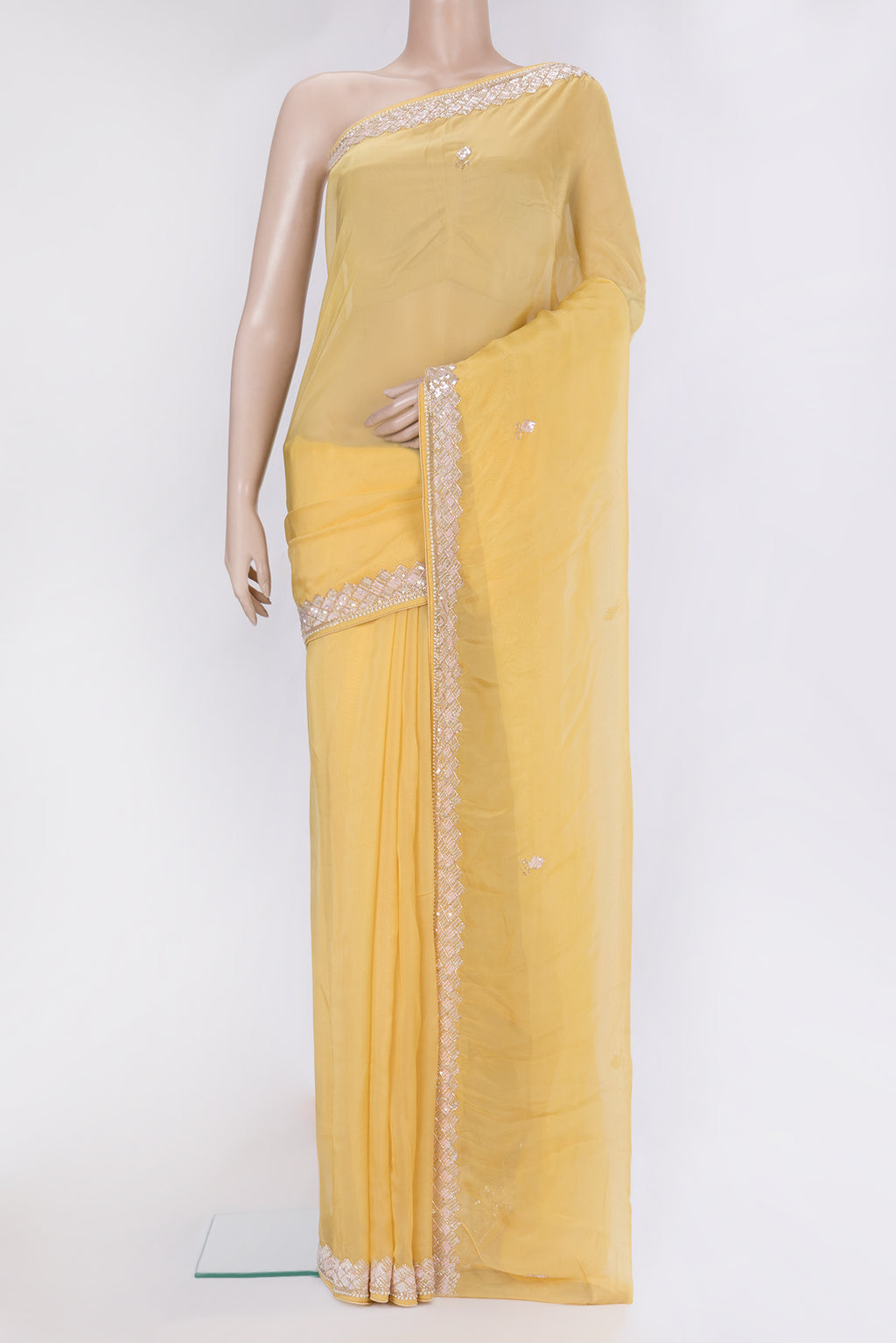 Sandal Organza Silk Saree with Embroidery on the body and Sequin Border.  displayed on a mannequin