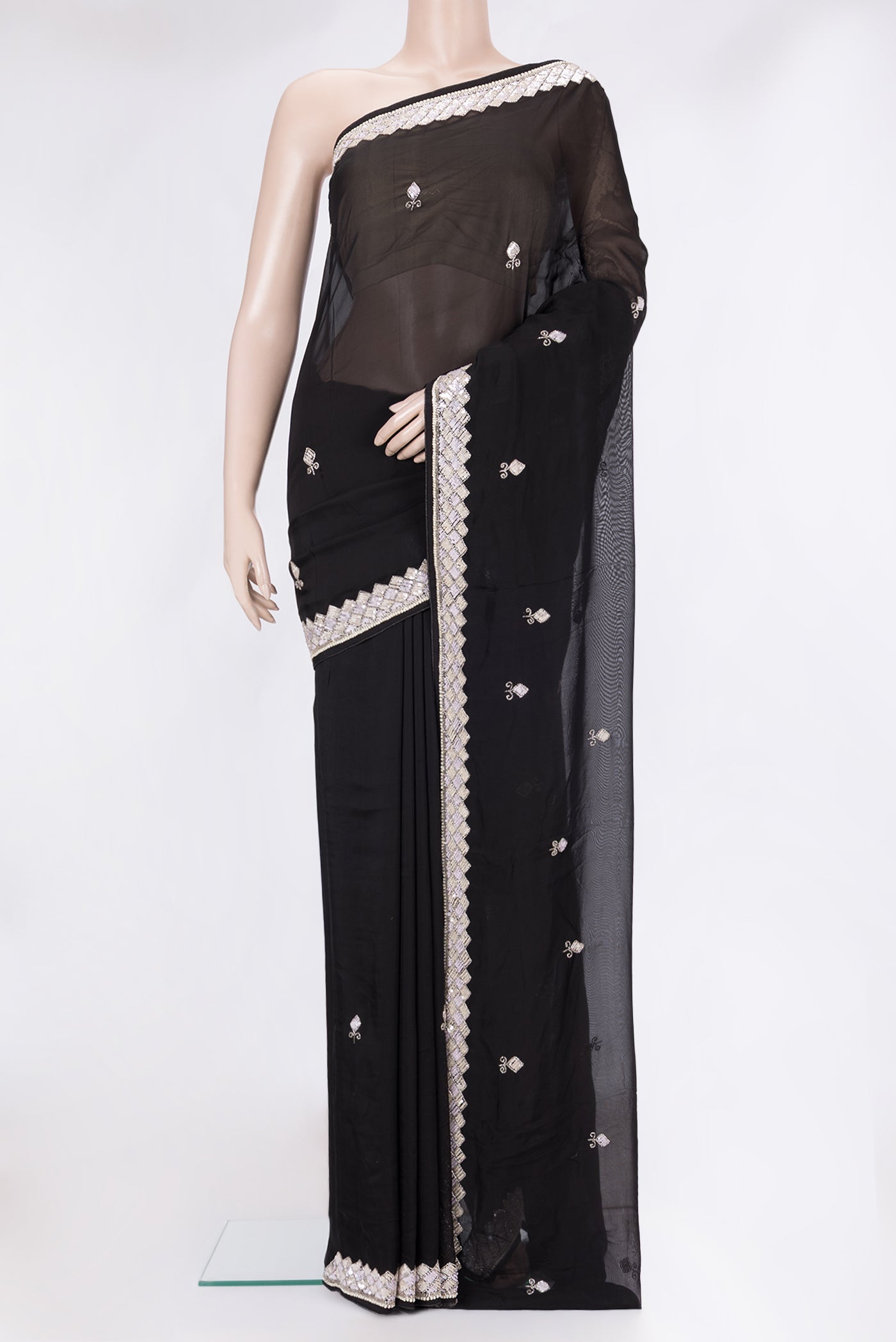 Black Georgette Saree with Embroidery on the body and Sequin Border.  displayed on a mannequin