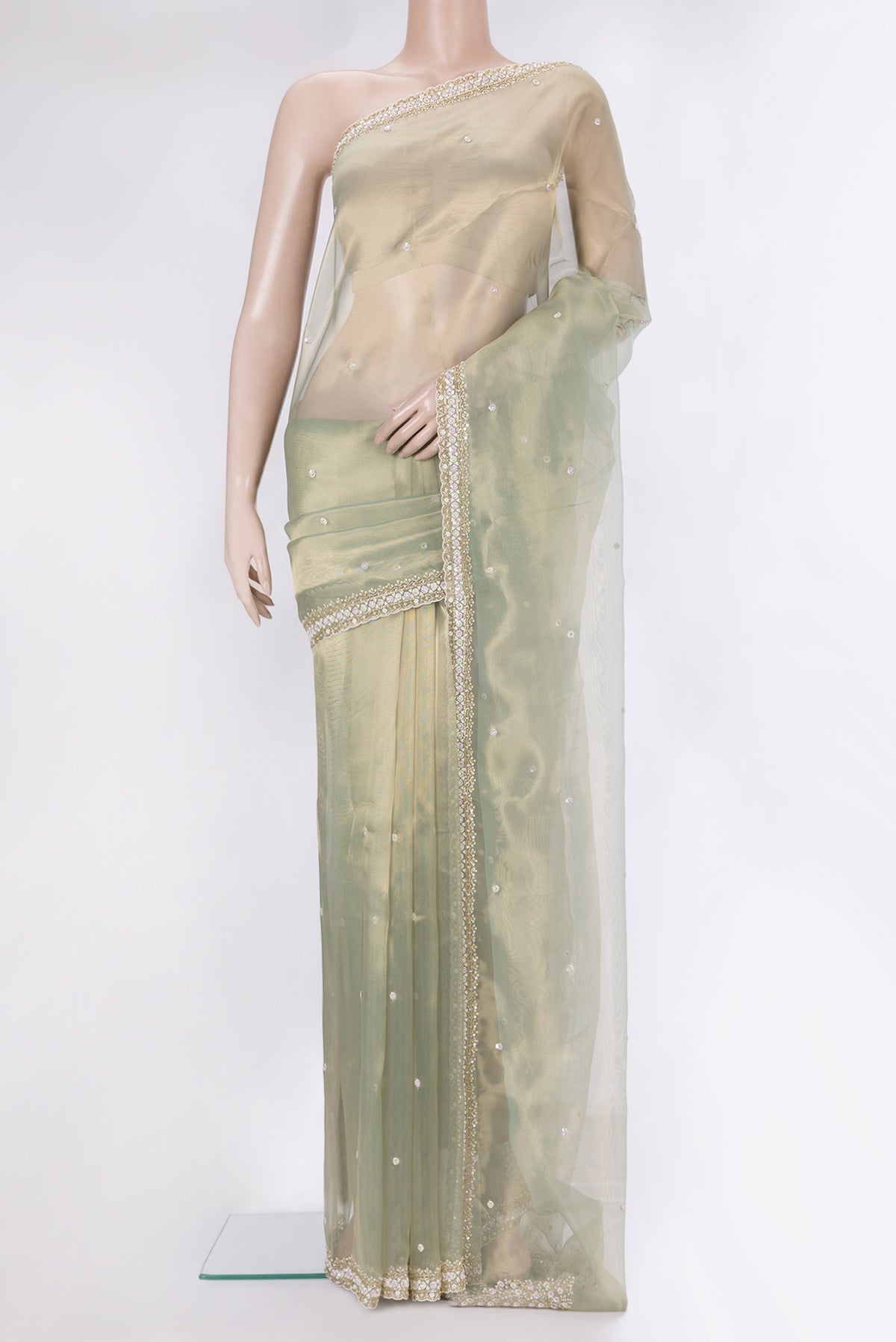 Light Green Dual Tone Organza Saree with Embroidery on the body and Sequin Border.  displayed on a mannequin
