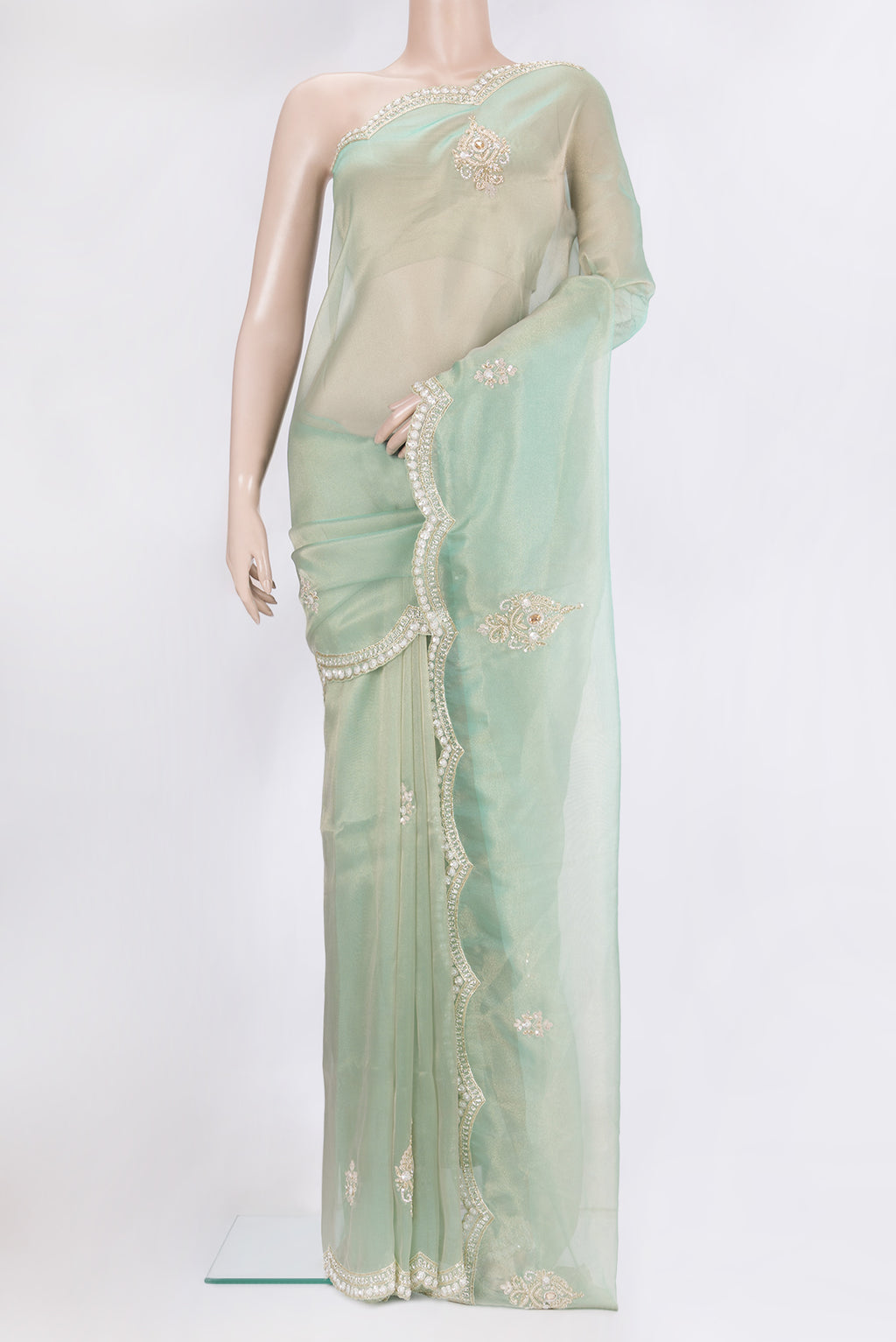 Light Green Dual Tone Organza Silk Saree with Embroidery on the body and Sequin Border.  displayed on a mannequin