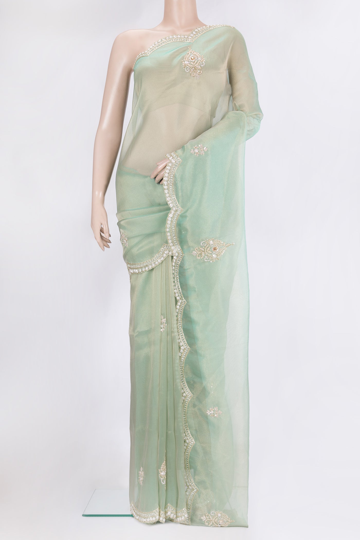 Light Green Dual Tone Organza Silk Saree with Embroidery on the body and Sequin Border.  displayed on a mannequin