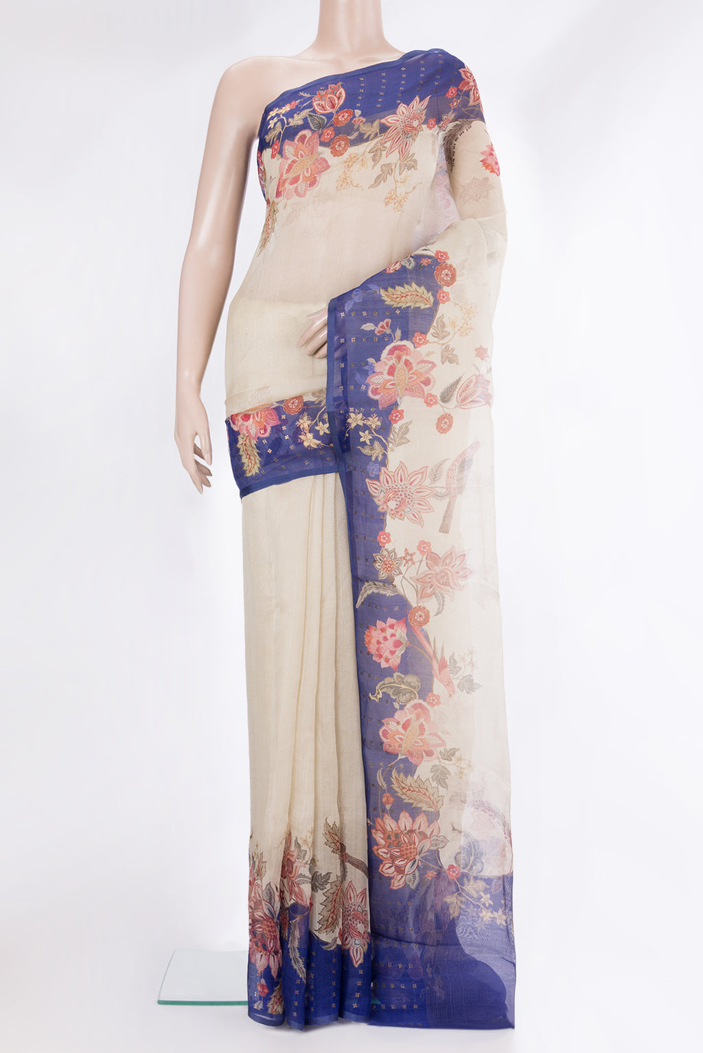 Cream Organza Saree with Floral Print on the body and Sequin Border.  displayed on a mannequin