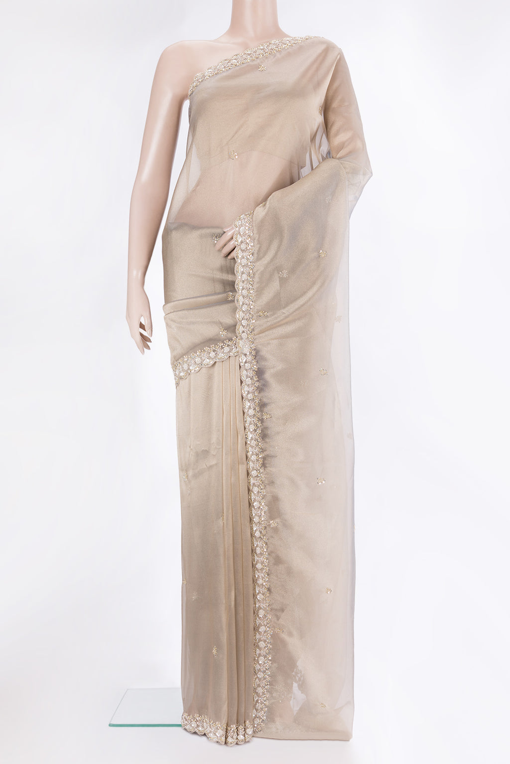 Beige Dual Tone Organza Saree with Embroidery on the body and Sequin Border.  displayed on a mannequin