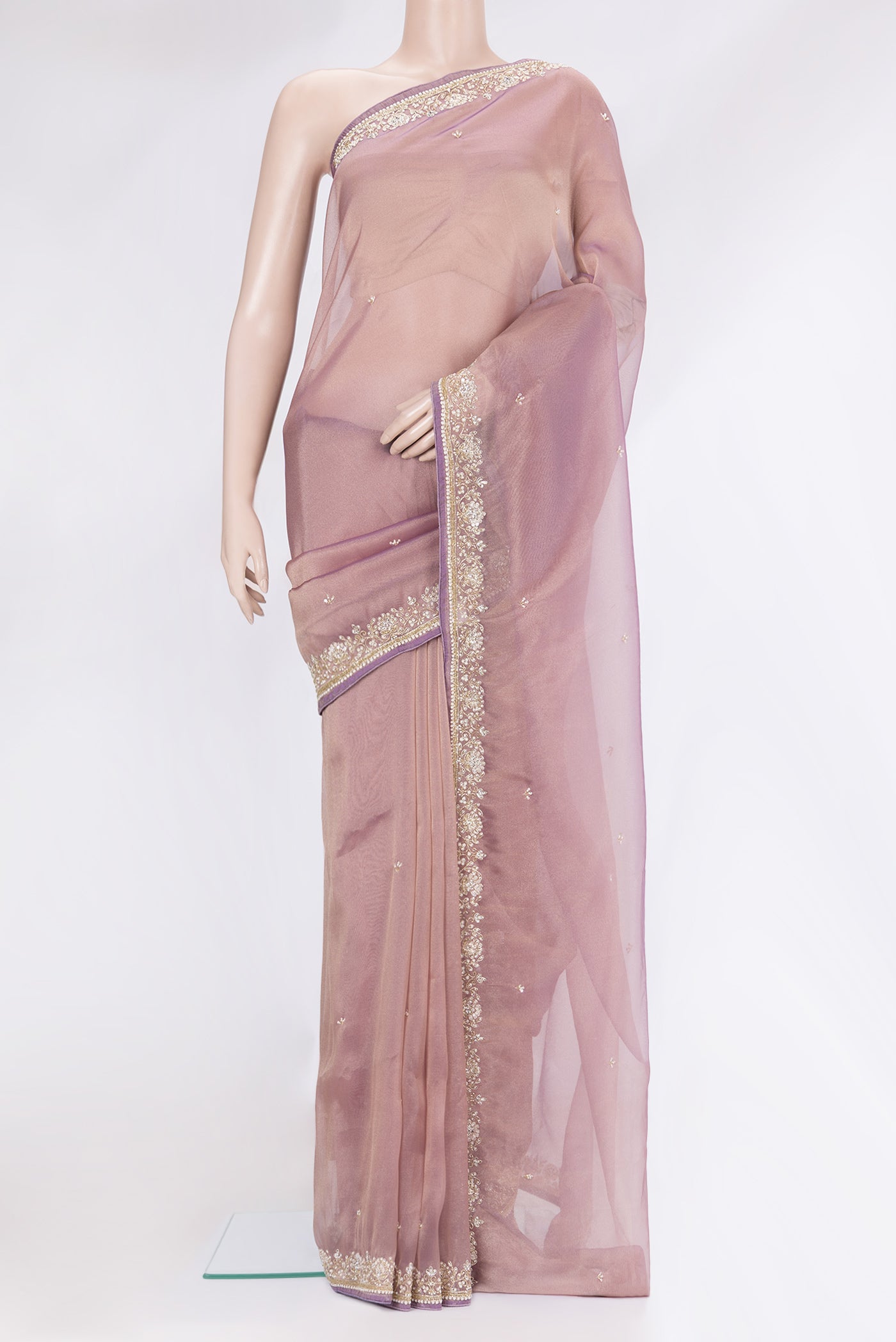 Purple Organza Silk Saree with Embroidery on the body and Sequin Border.  displayed on a mannequin