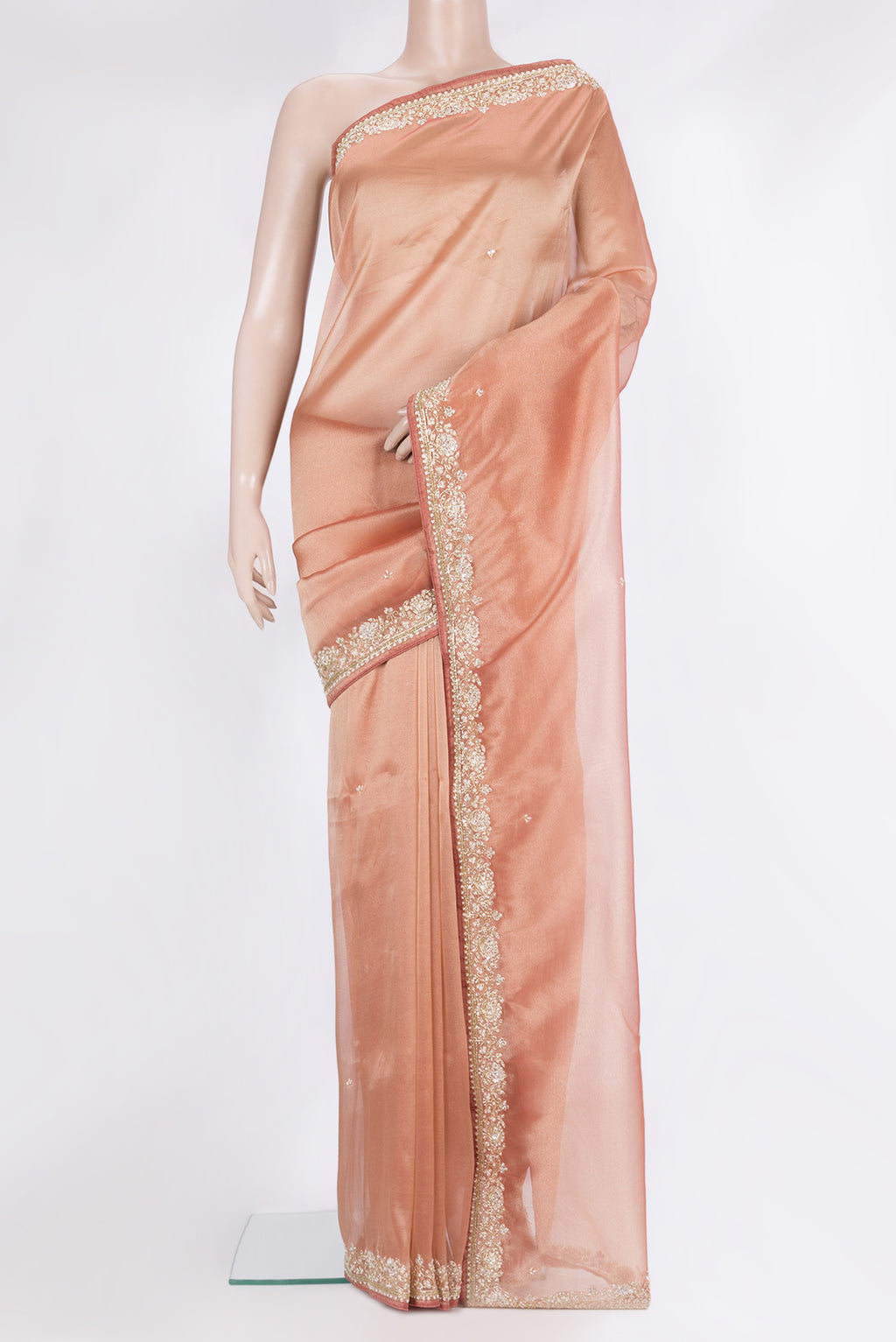 Peach Dual Tone Organza Saree with Embroidery on the body and Sequin Border.  displayed on a mannequin