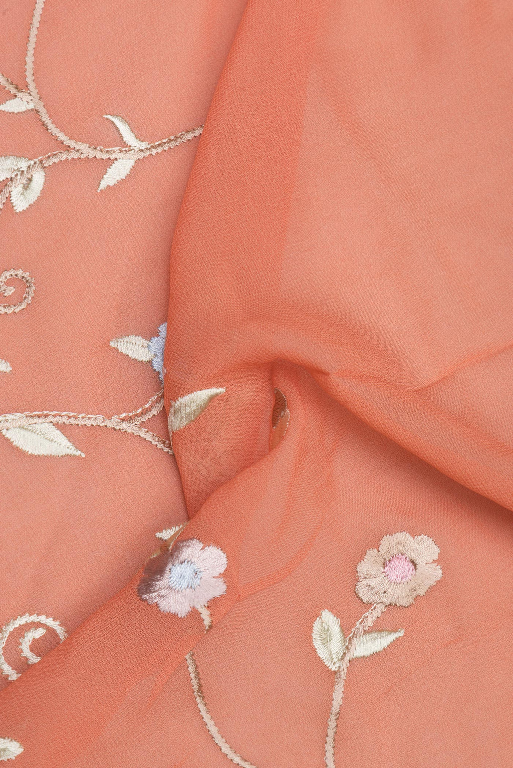 Close up of Peach Parsi Embroidered Saree with Embroidered on the body and Thread Embroidered Border.  displaying folds