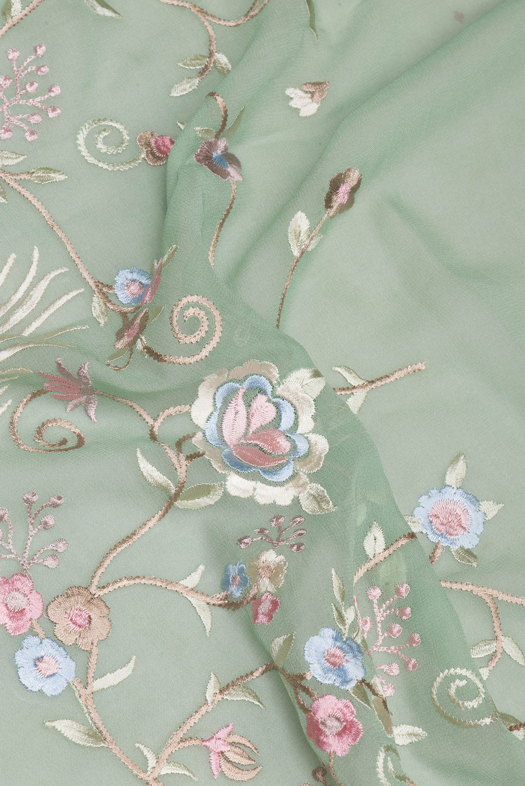 Close up of Sage Green Georgette Saree with Embroidery on the body and Embroidery Border.  displaying folds